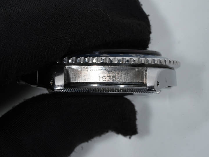 Rolex GMT Master Ref. 1675, stainless steel, black dial, Oyster bracelet, pre-owned. (inr48cp2 appears to be an internal reference number and not part of the product description)