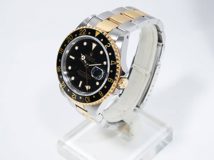 Pre-owned Rolex GMT-Master II Ref. 16713 in stainless steel/yellow gold with a black dial and Oyster bracelet (ygieugp7)