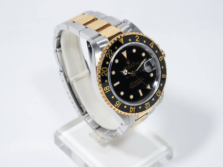 Pre-owned Rolex GMT-Master II Ref. 16713 in stainless steel/yellow gold with a black dial and Oyster bracelet (ygieugp7)