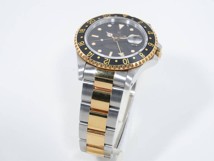 Pre-owned Rolex GMT-Master II Ref. 16713 in stainless steel/yellow gold with a black dial and Oyster bracelet (ygieugp7)