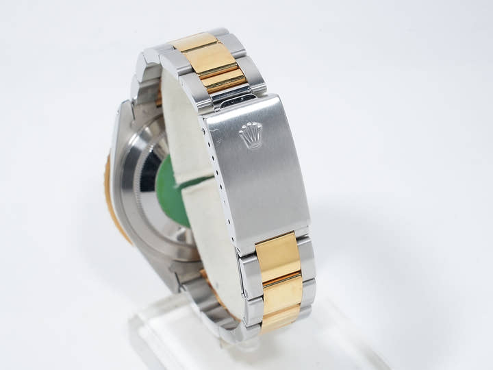 Pre-owned Rolex GMT-Master II Ref. 16713 in stainless steel/yellow gold with a black dial and Oyster bracelet (ygieugp7)