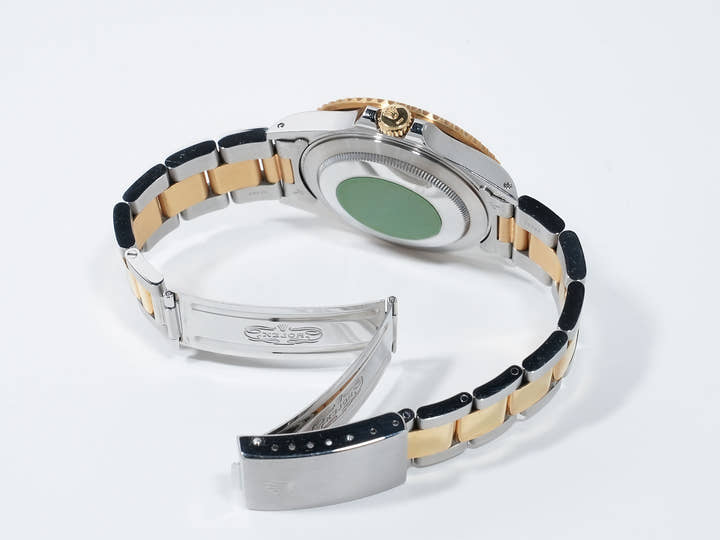 Pre-owned Rolex GMT-Master II Ref. 16713 in stainless steel/yellow gold with a black dial and Oyster bracelet (ygieugp7)