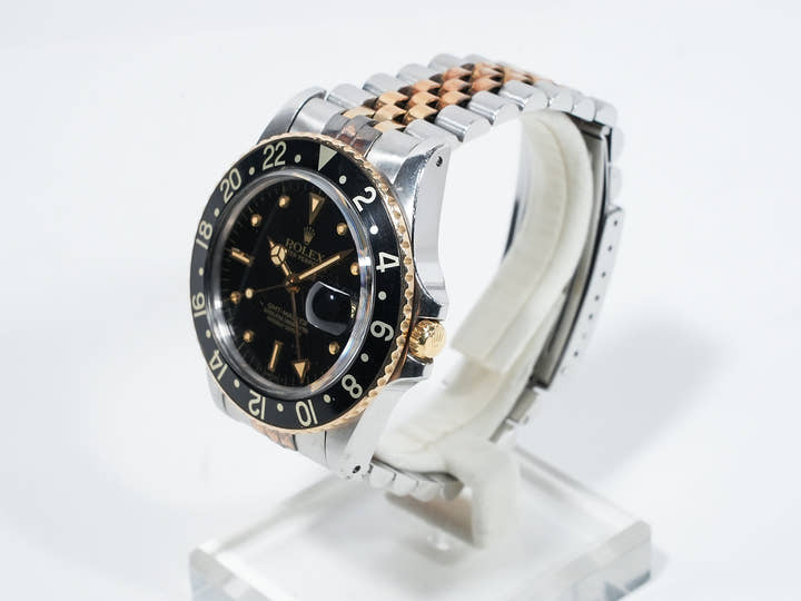 Pre-owned Rolex GMT-Master Ref. 16753 in stainless steel/yellow gold with a black dial and Jubilee bracelet (xkrpyj86)