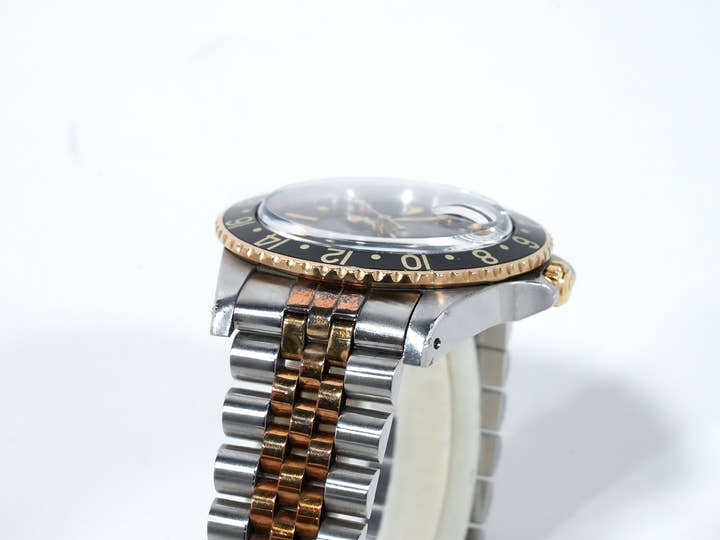 Pre-owned Rolex GMT-Master Ref. 16753 in stainless steel/yellow gold with a black dial and Jubilee bracelet (xkrpyj86)