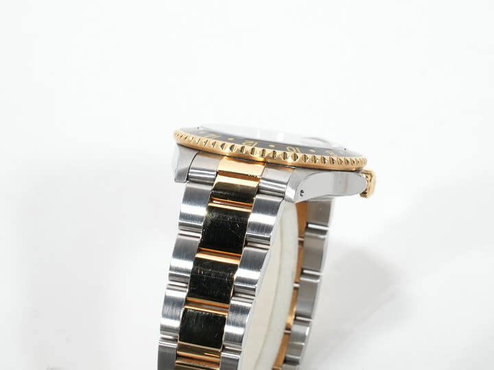 Pre-owned Rolex GMT-Master II Ref. 16713 in stainless steel/yellow gold with a black dial and Oyster bracelet (anvkf7ce)