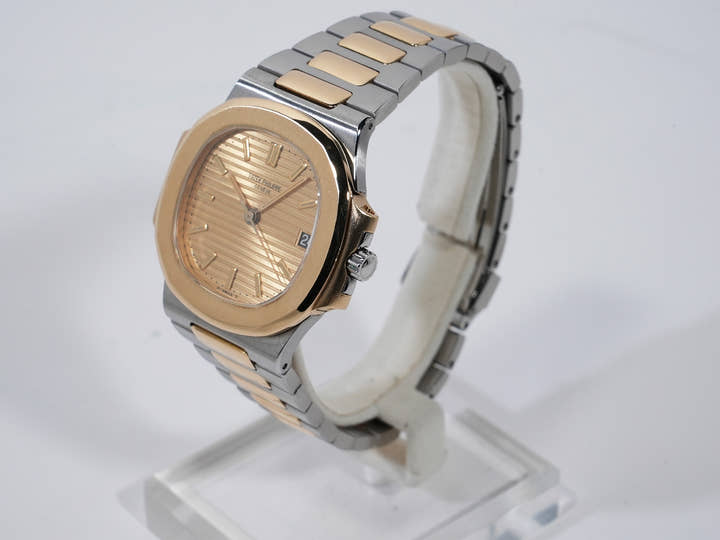 Patek Philippe Nautilus Ref. 3800/1JA Stainless Steel/Yellow Gold Champagne Dial Used c57cxbmq
