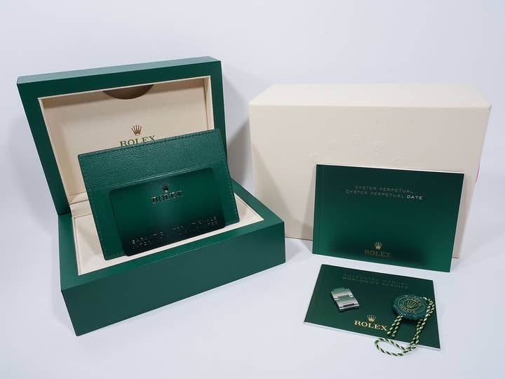 Rolex Oyster Perpetual 41 Ref. 124300 Stainless Steel with Celebration Motif Dial