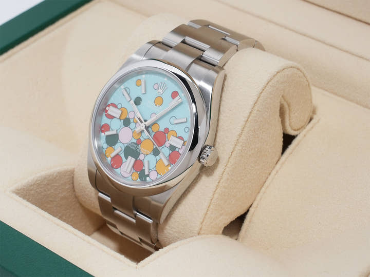 Rolex Oyster Perpetual 41 Ref. 124300 Stainless Steel with Celebration Motif Dial