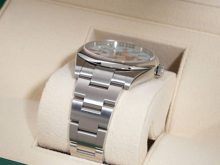 Rolex Oyster Perpetual 41 Ref. 124300 Stainless Steel with Celebration Motif Dial