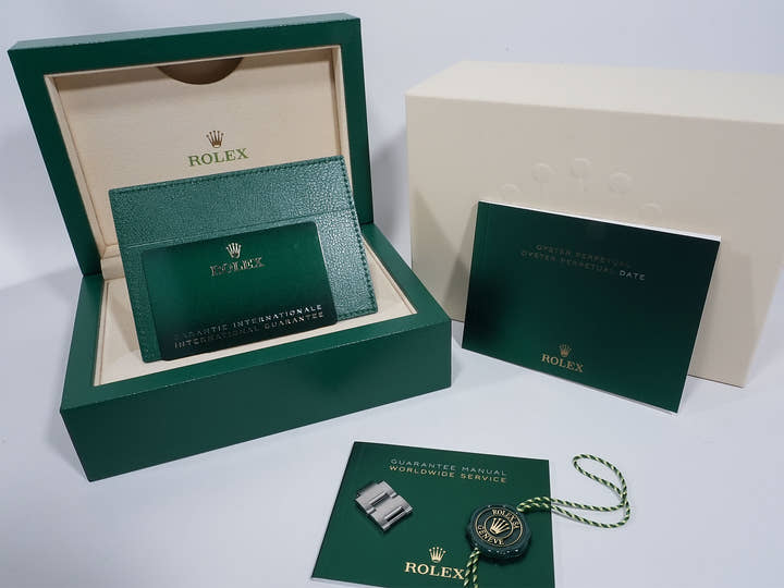 Rolex Oyster Perpetual 41 Ref. 124300 Stainless Steel with Celebration Motif Dial