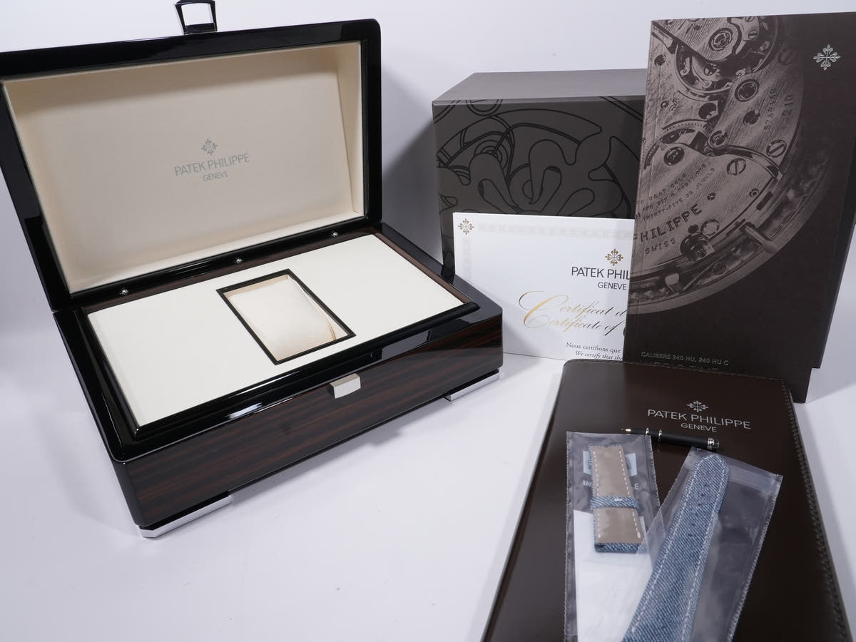 Patek Philippe Complication World Time Date Ref. 5330G-001 18KWG blue-grey opaline dial, unused.