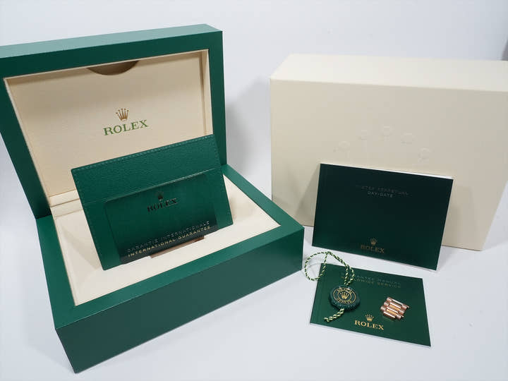 Rolex Day-Date 36 Ref. 128235 Everose Gold Slate Dial with 10 Diamond Hour Markers, Pre-owned, Excellent Condition.  (66kk6ak3 appears to be an internal reference number and is not translated)