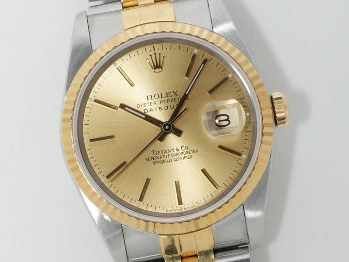 Pre-owned Rolex Datejust 36 with TIFFANY double name, Ref. 16233, stainless steel/yellow gold, champagne dial, ezoq67dh