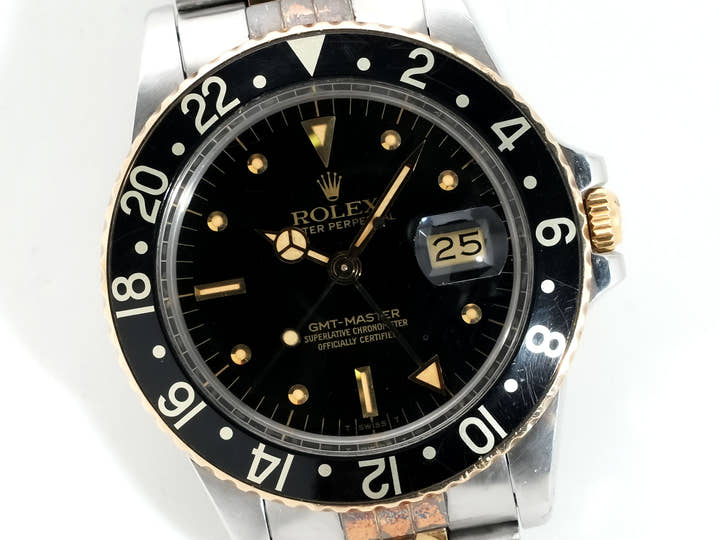 Pre-owned Rolex GMT-Master Ref. 16753 in stainless steel/yellow gold with a black dial and Jubilee bracelet (xkrpyj86)