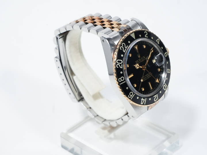 Pre-owned Rolex GMT-Master Ref. 16753 in stainless steel/yellow gold with a black dial and Jubilee bracelet (xkrpyj86)