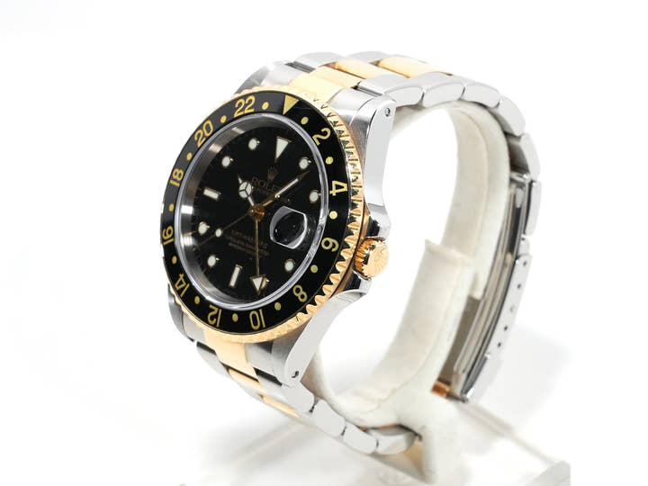 Pre-owned Rolex GMT-Master II Ref. 16713 in stainless steel/yellow gold with a black dial and Oyster bracelet (anvkf7ce)