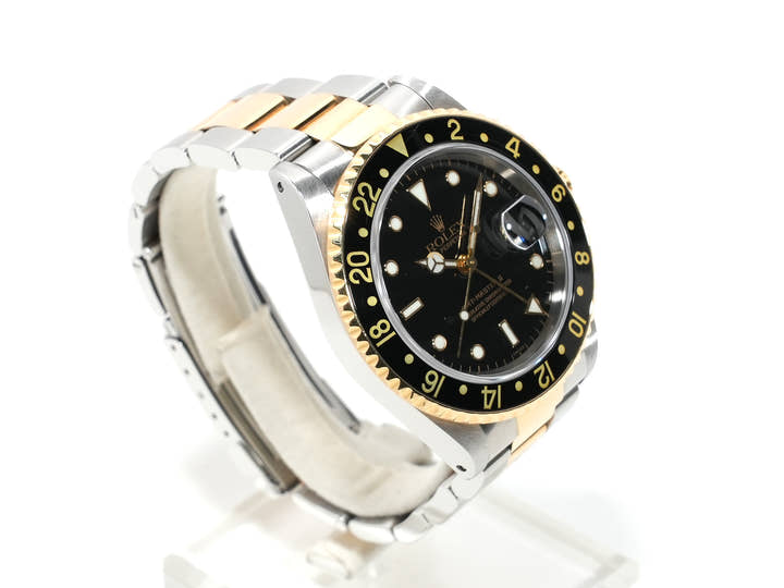 Pre-owned Rolex GMT-Master II Ref. 16713 in stainless steel/yellow gold with a black dial and Oyster bracelet (anvkf7ce)