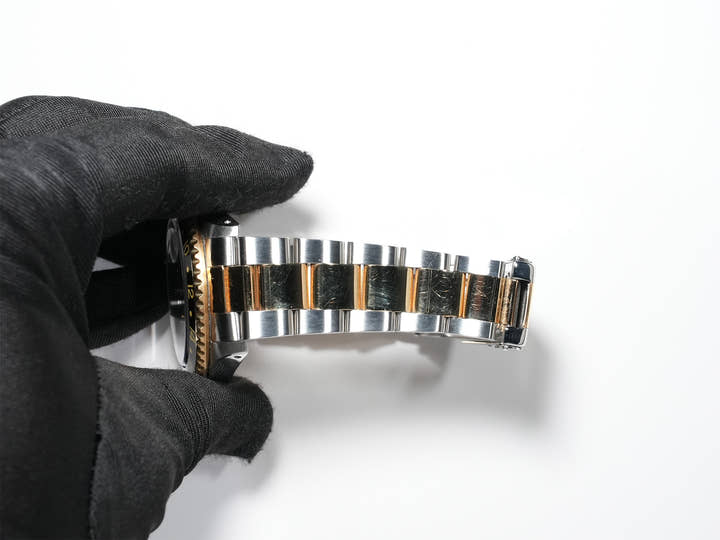 Pre-owned Rolex GMT-Master II Ref. 16713 in stainless steel/yellow gold with a black dial and Oyster bracelet (anvkf7ce)