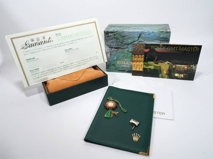 Pre-owned Rolex GMT-Master II Ref. 16713 in stainless steel/yellow gold with a black dial and Oyster bracelet (anvkf7ce)