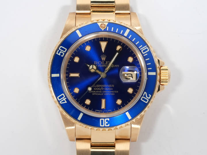 Rolex Submariner Date Ref. 16808 Yellow Gold Blue Dial Pre-owned swcopyzn