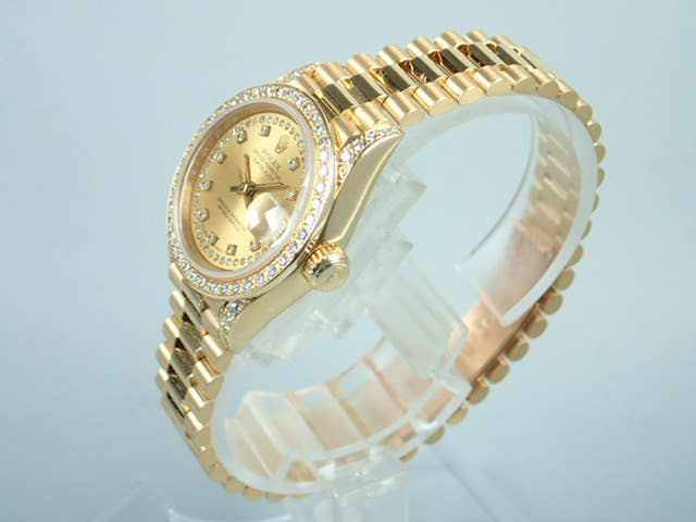 Rolex Datejust Ref. 69158, Millegrain diamond dial, pre-owned, President bracelet.