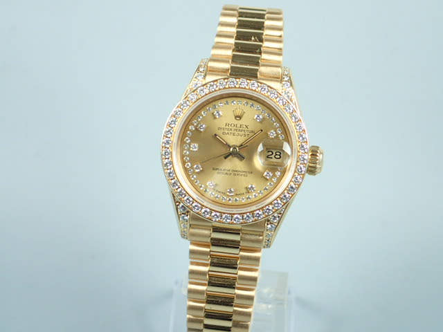 Rolex Datejust Ref. 69158, Millegrain diamond dial, pre-owned, President bracelet.