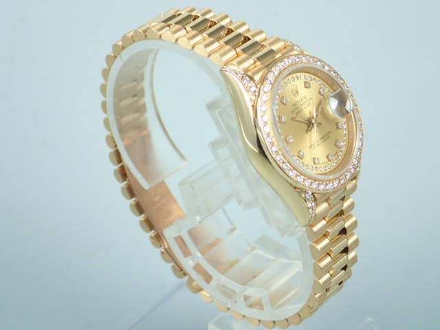 Rolex Datejust Ref. 69158, Millegrain diamond dial, pre-owned, President bracelet.