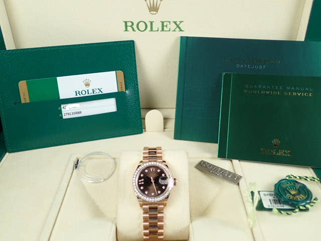 Pre-owned Rolex Datejust Ref. 279135RBR with chocolate dial, 9 star-shaped diamonds, and President bracelet.  (datejust-80)