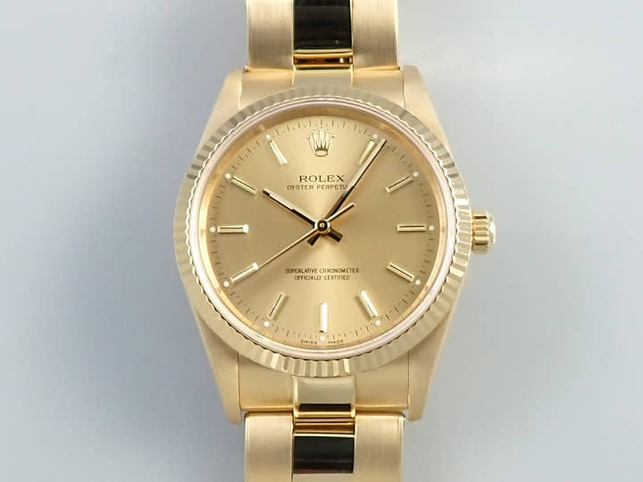 Rolex Oyster Perpetual Ref. 14238 Yellow Gold Champagne Dial