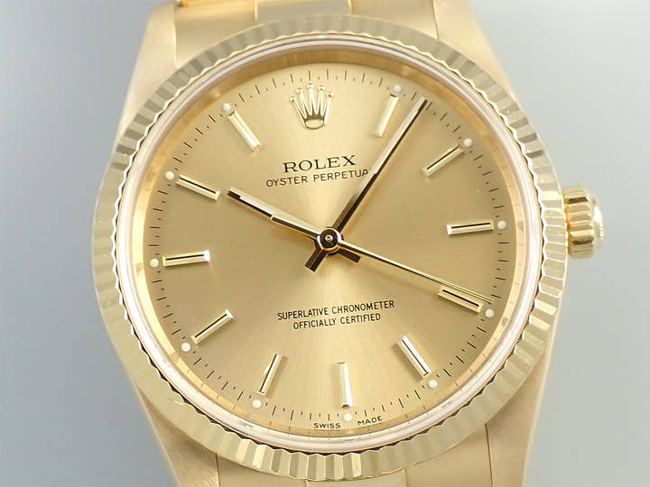 Rolex Oyster Perpetual Ref. 14238 Yellow Gold Champagne Dial