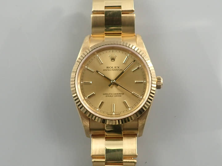 Rolex Oyster Perpetual Ref. 14238M Yellow Gold Champagne Dial