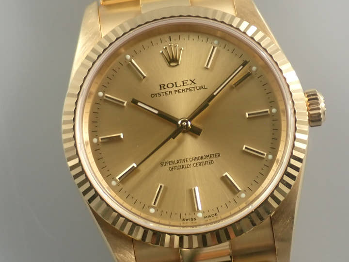 Rolex Oyster Perpetual Ref. 14238M Yellow Gold Champagne Dial